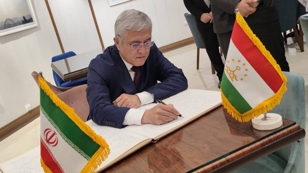 Signing of the Azadi Tower memorial notebook  by the director of land and geodesy of the Republic of Tajikistan